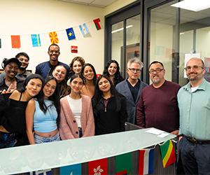 Image of Loik Makuza with group of international students.